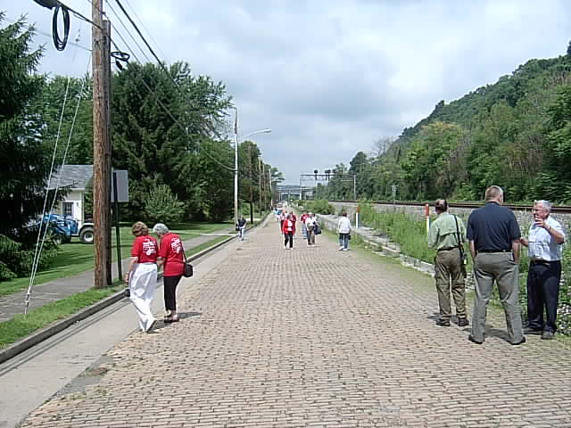 Conference bus tour participants inspect "The Yellow Brick Road," a 