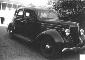 [Photo of Wes Hammond in a 1936 Ford]