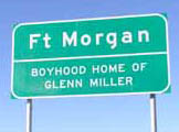 [Photo of a sign that reads 'Fort Morgan: Boyhood Home of Glenn Miller']
