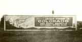 [Photo of a sign with a map of the Colorado Loop that reads 'Lincoln-Highway to COLORADO and Rocky Mountain National-Estes Park']