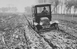 Photo of car stuck in mud